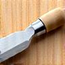 Icône de ciseau à bois symbolisant l'artisanat